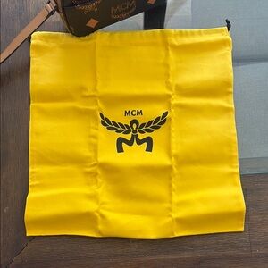 MCM Yellow and Black Backpack with Iconic Logo